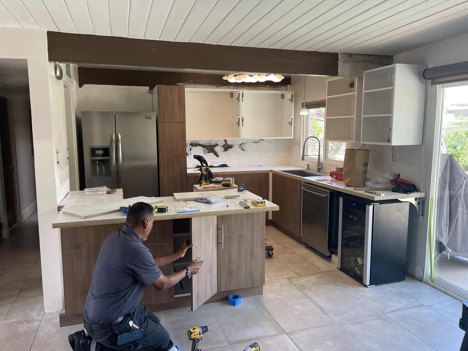 Cabinet installer fitting the kitchen island