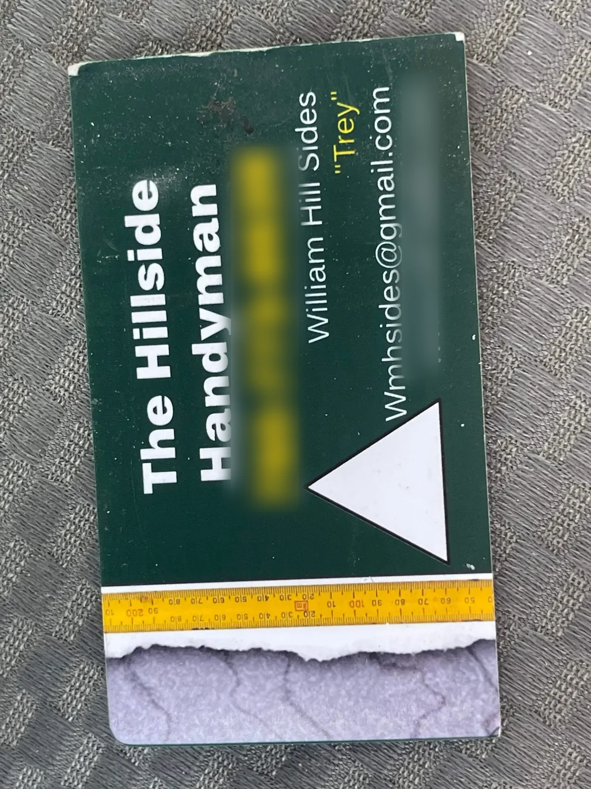 My old green business card from the California years, with the old phone number and website blurred